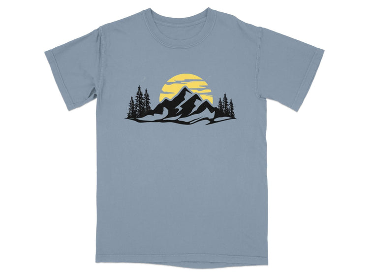 Black mountain silhouette with yellow sun and pine trees on a blue t-shirt.