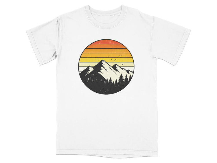 T-shirt with a circular graphic of mountains and trees at sunset.