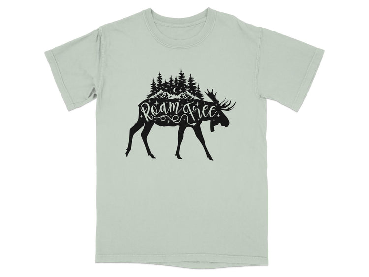 Moose silhouette with mountains, trees, and "roam free" text on a pale green t-shirt.