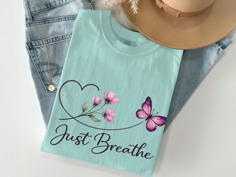 Mint t-shirt with a butterfly and flowers design and "Just Breathe" text.