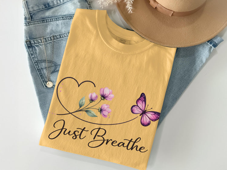 Yellow t-shirt with "Just Breathe" text, butterfly, and flowers.