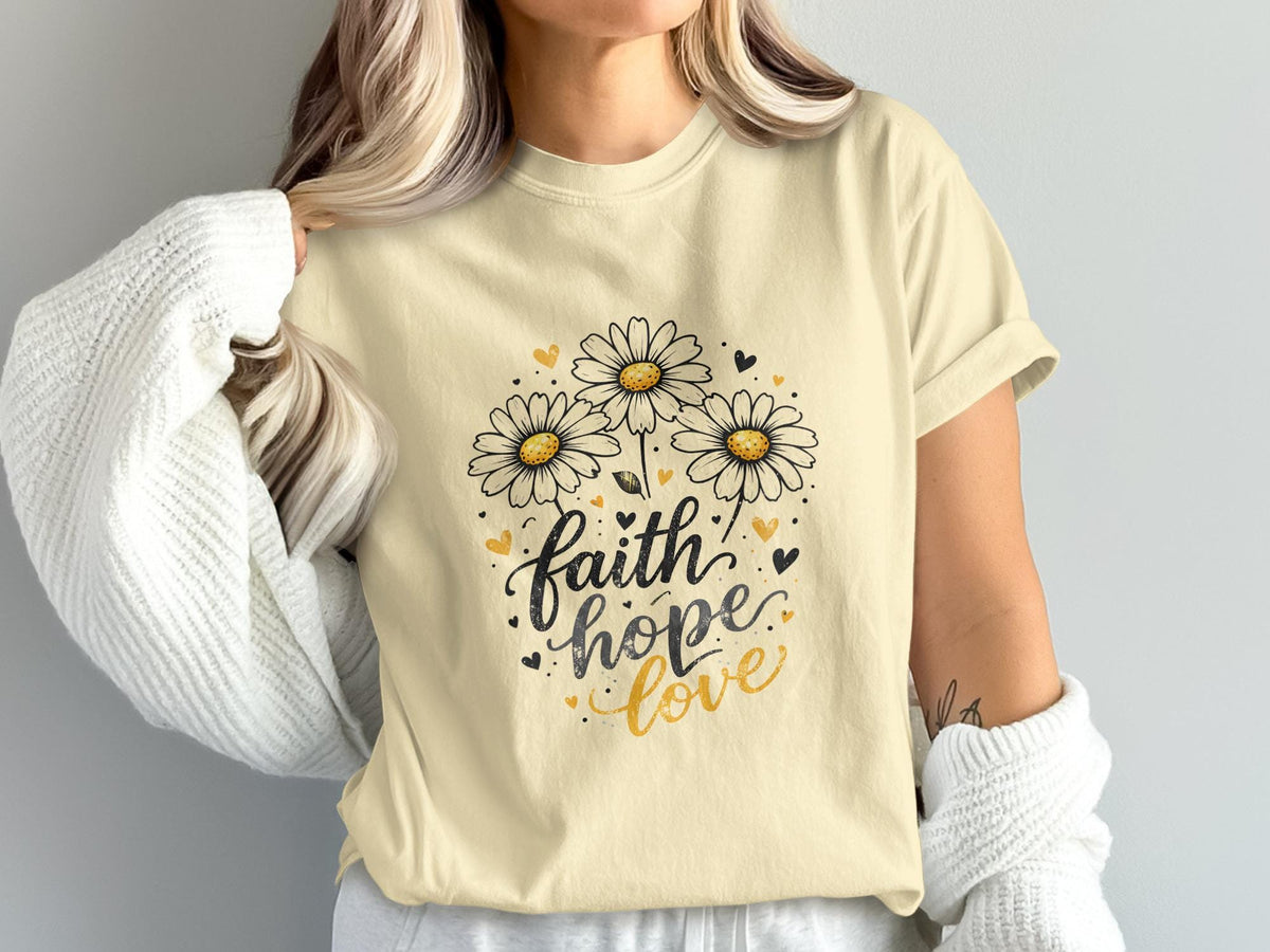 Light yellow t-shirt with daisies and "faith hope love" text.