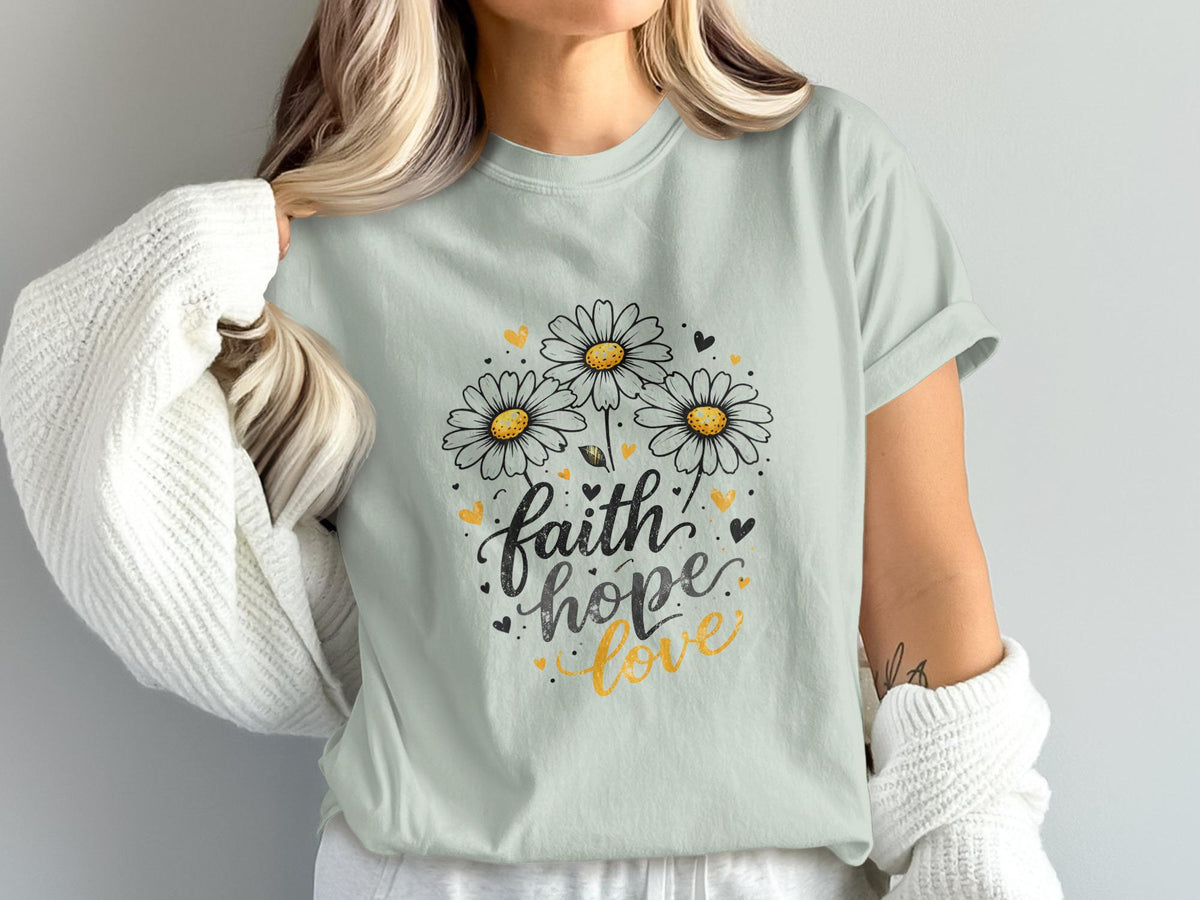 Light blue t-shirt with "faith hope love" and daisy design.