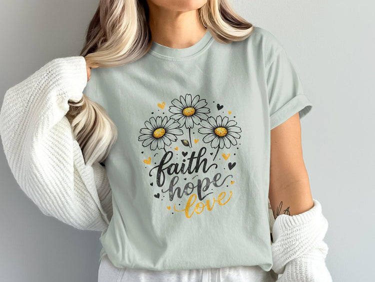 Light blue t-shirt with "faith hope love" and daisy design.