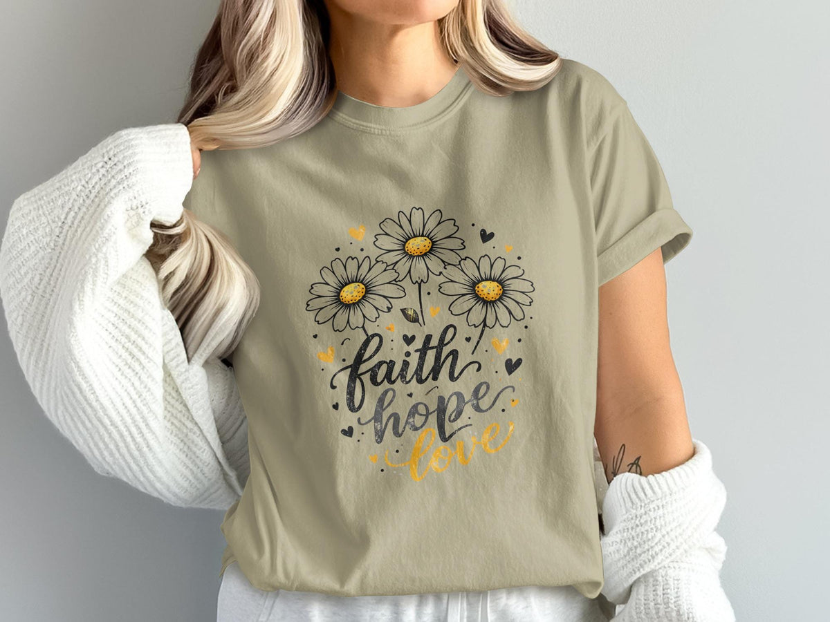 T-shirt with "faith hope love" text and three daisies.