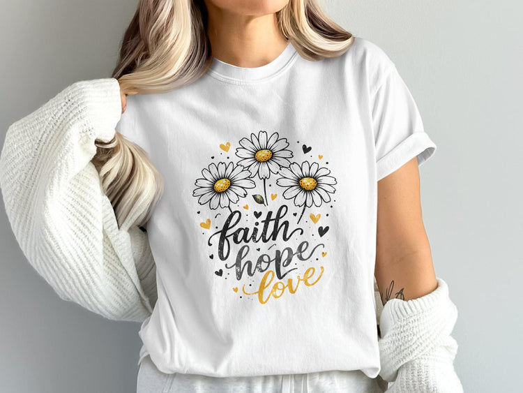 White t-shirt with "Faith hope love" text and daisy illustrations.