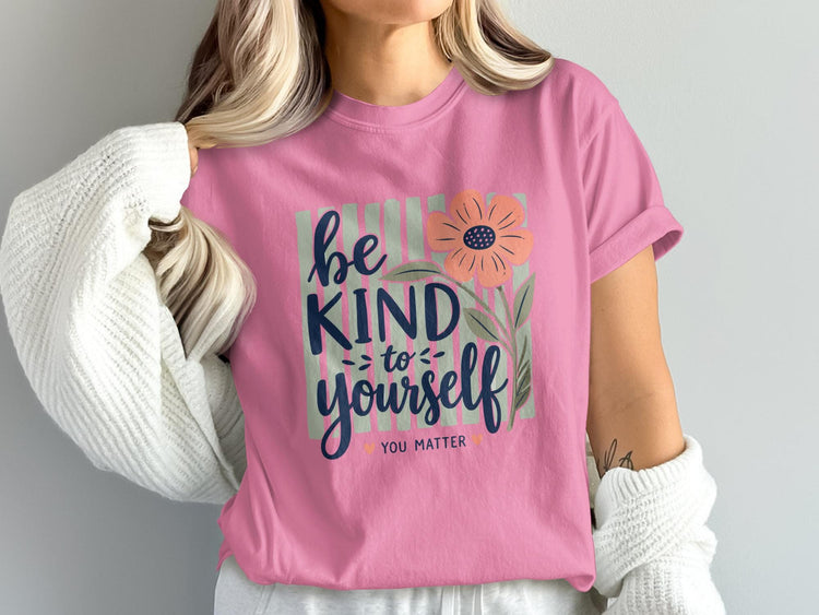 Pink t-shirt with "be kind to yourself you matter" and flower graphic.