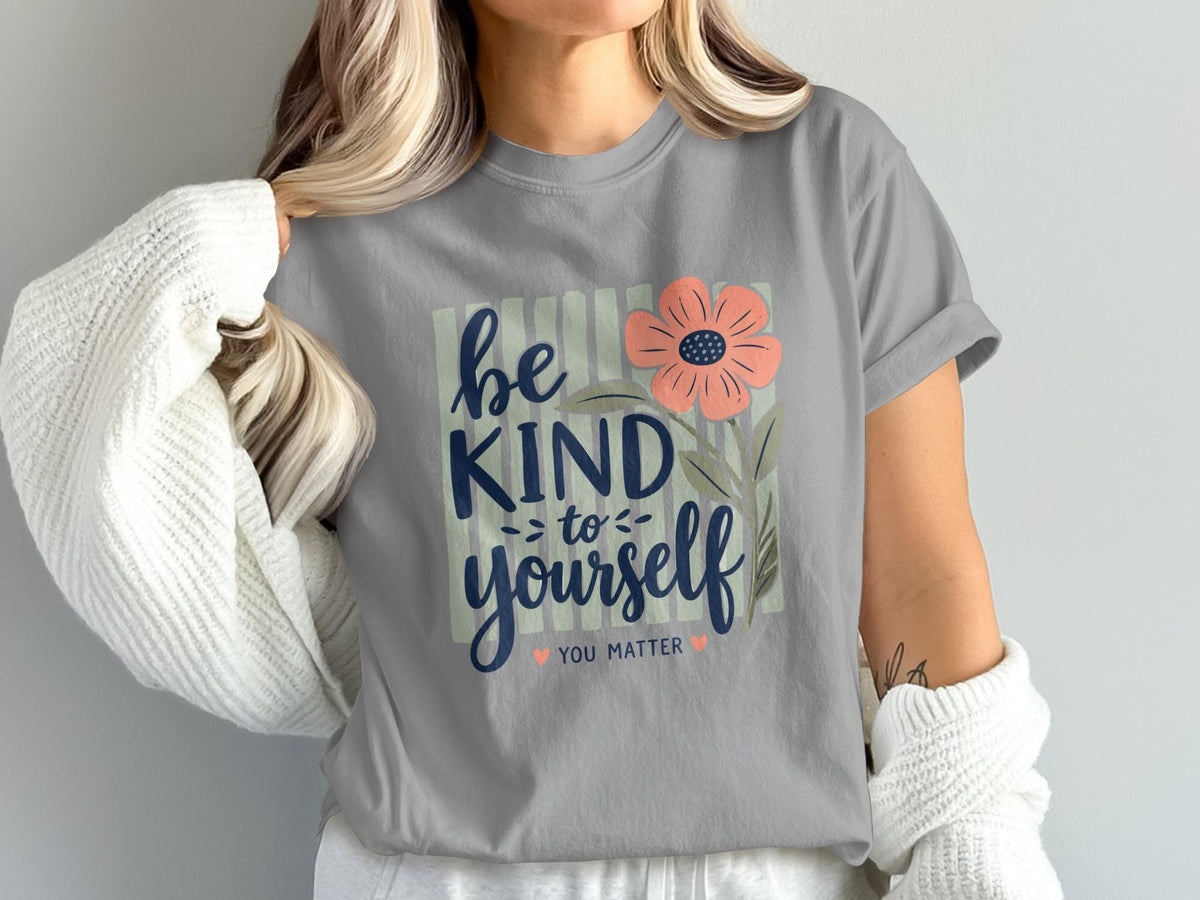 Gray t-shirt with "be kind to yourself" text and a pink flower.