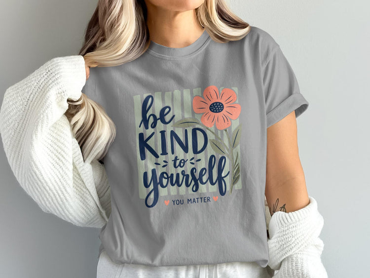 Gray t-shirt with "be kind to yourself" text and a pink flower.