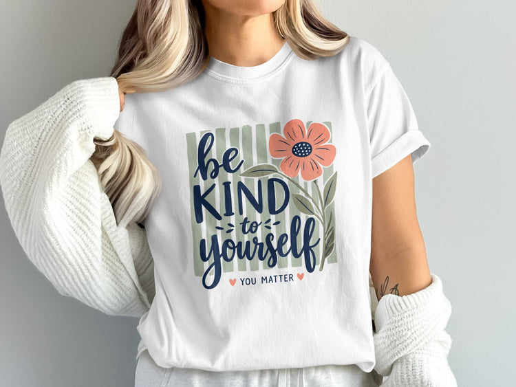 White t-shirt with "Be Kind To Yourself You Matter" text and floral design.