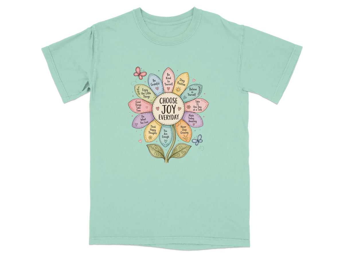 T-shirt with a flower design listing inspirational phrases like "Choose Joy Everyday".