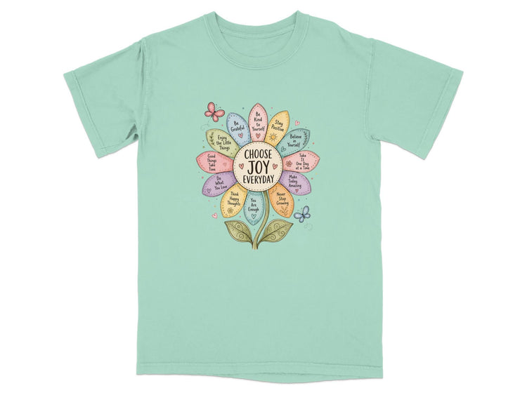 T-shirt with a flower design listing inspirational phrases like "Choose Joy Everyday".