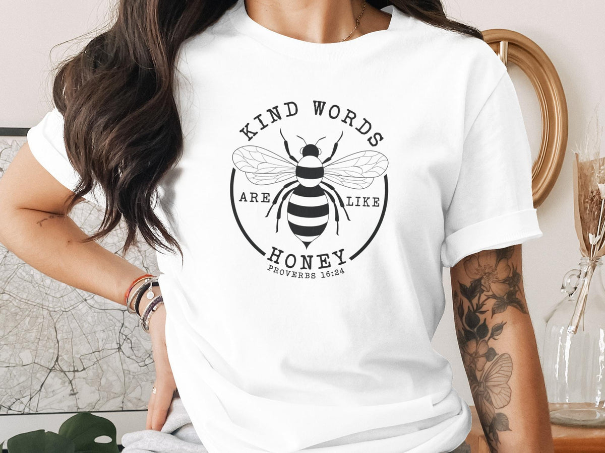 White t-shirt with a bee graphic and "Kind Words Are Like Proverbs 16:24" text.
