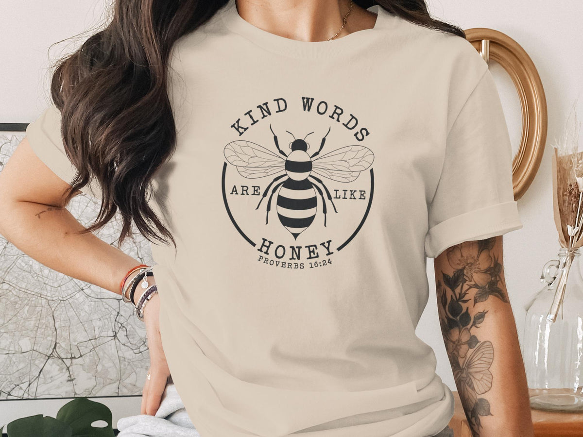 T-shirt with a bee graphic and the text "Kind words are like honey. Proverbs 16:24."