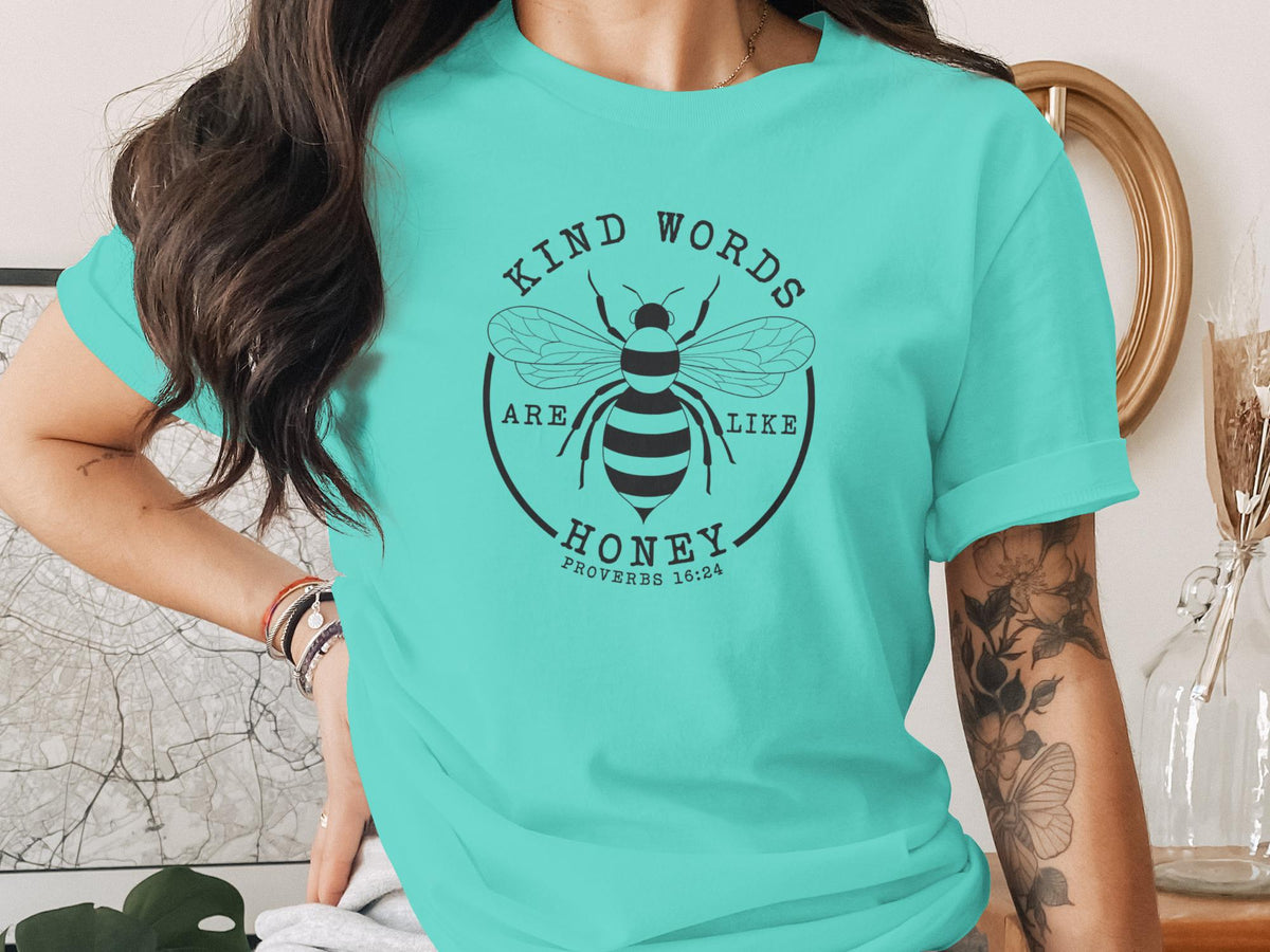 Teal t-shirt with "Kind words are like honey" and bee graphic, Proverbs 16:24.