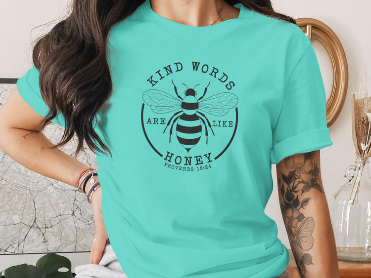 Teal t-shirt with "Kind words are like honey" and bee graphic, Proverbs 16:24.