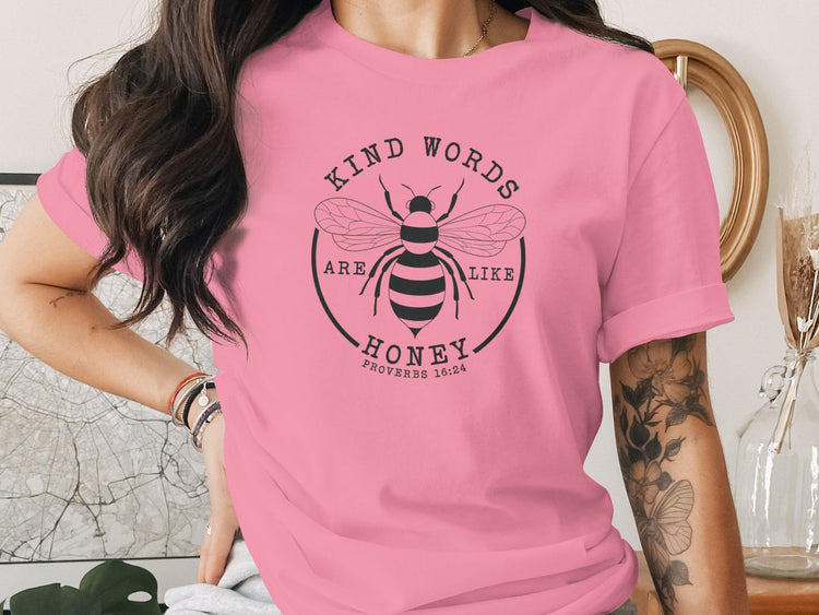 Pink t-shirt with "Kind Words Are Like Honey" bee design, Proverbs 16:24.