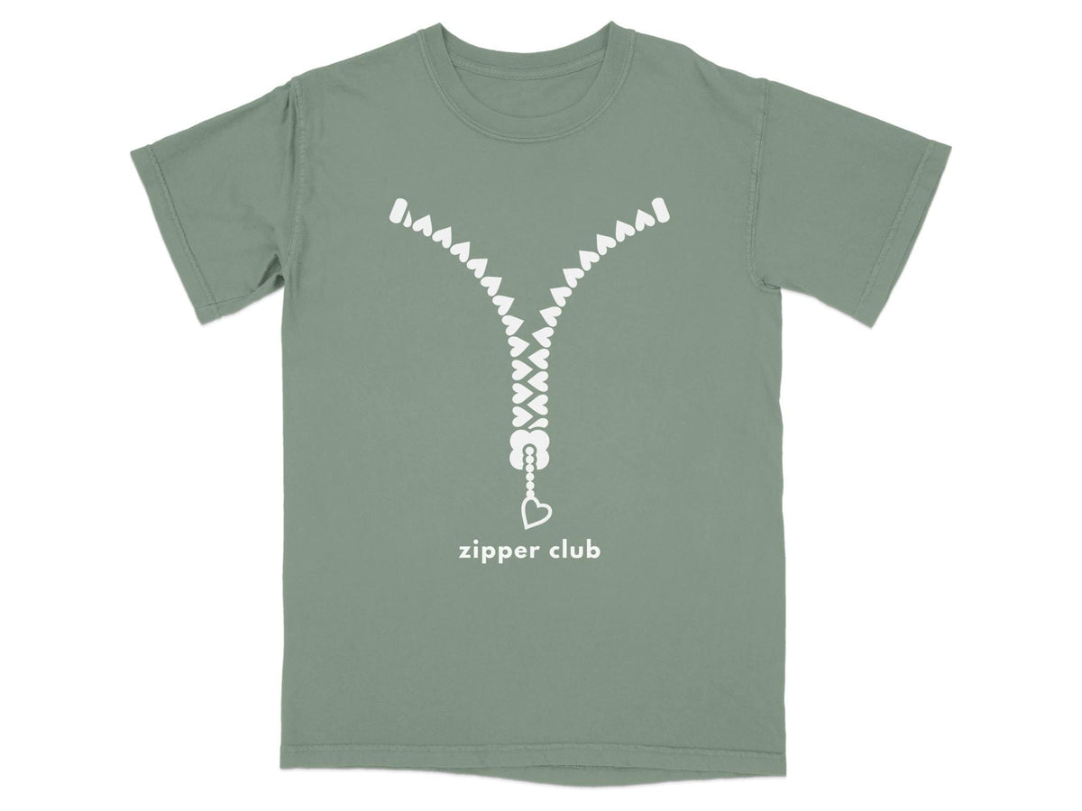 Green t-shirt with white zipper graphic and "zipper club" text.