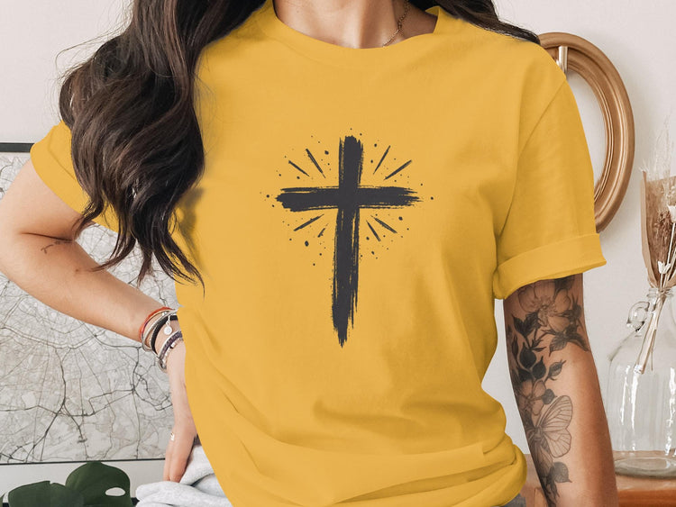Yellow t-shirt with distressed black Christian cross graphic.