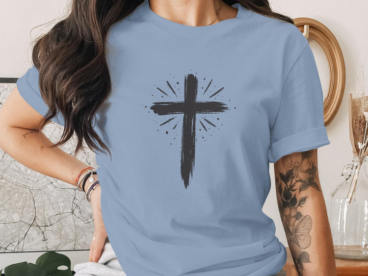 Light blue t-shirt with a distressed black cross graphic.