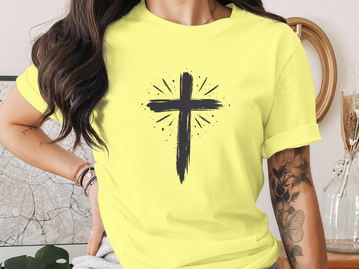 Yellow t-shirt with a black distressed cross graphic and radiating lines.
