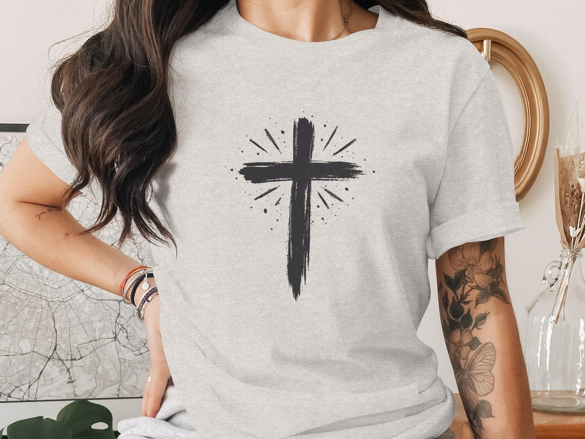 Gray t-shirt with a black brush stroke cross design.