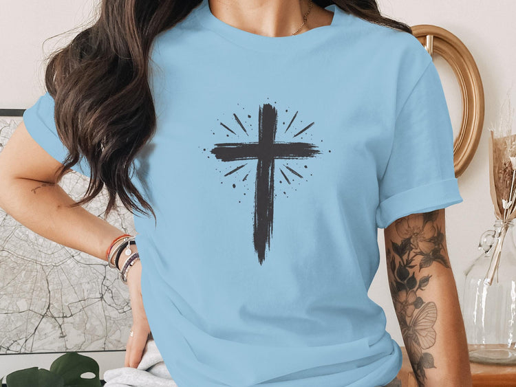 Light blue t-shirt with a distressed black cross graphic.