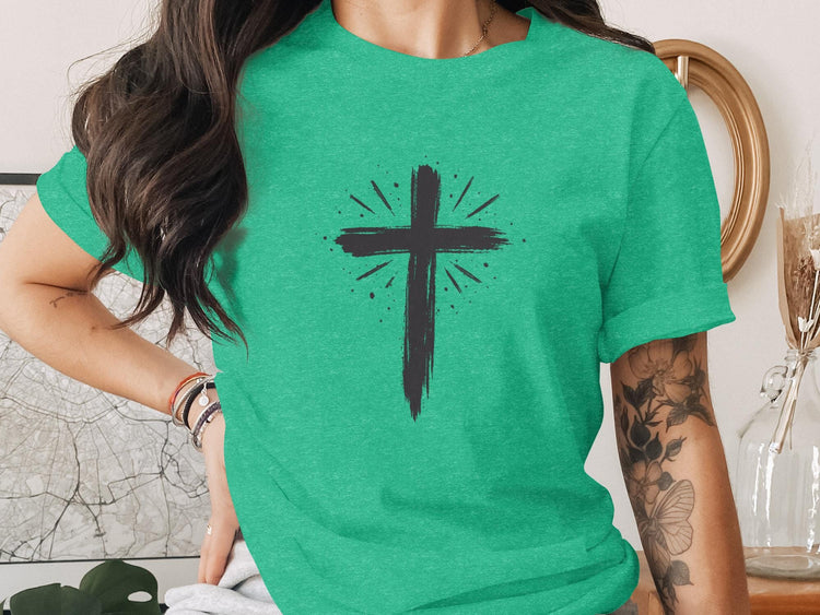 Teal t-shirt with a distressed black cross graphic.