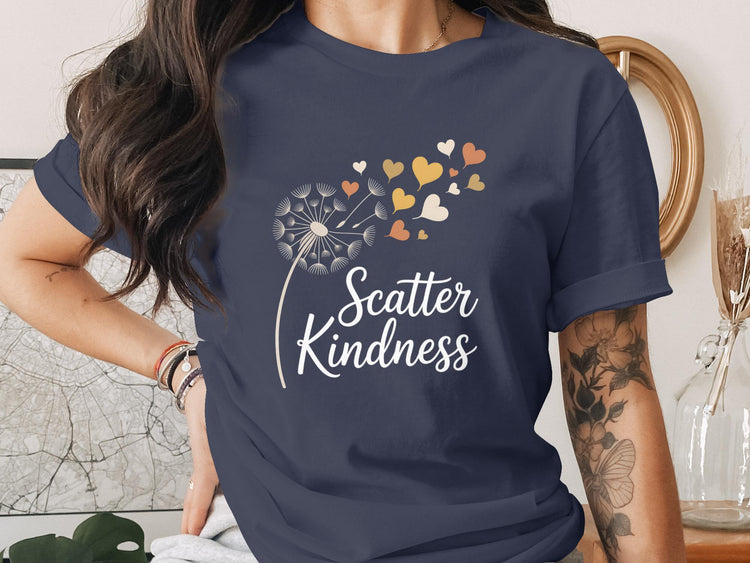 Navy t-shirt with dandelion and "Scatter Kindness" text.