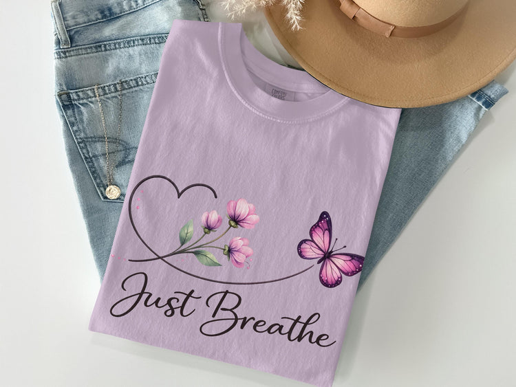 Lilac t-shirt with "Just Breathe" text, heart, flowers, and butterfly.