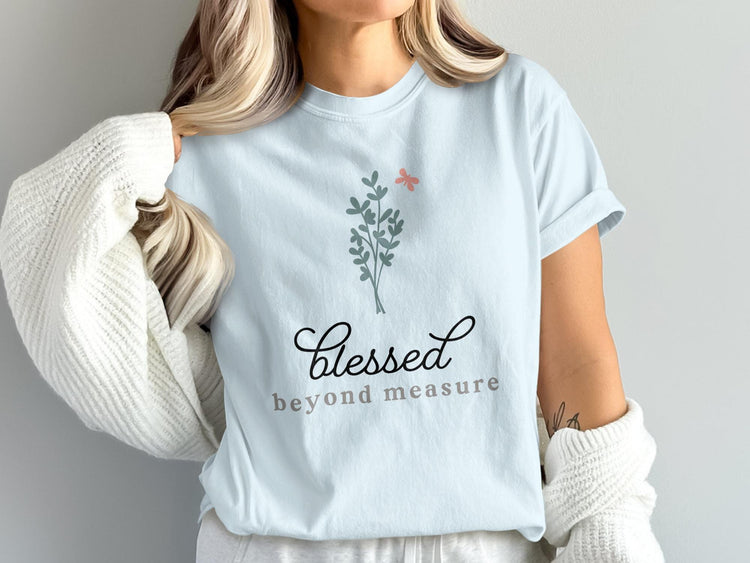 Light blue t-shirt with "Blessed beyond measure" text and floral graphic.