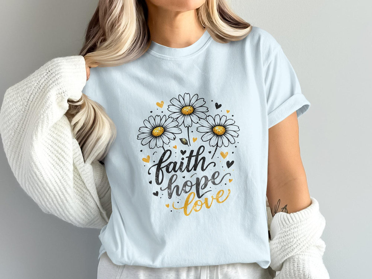 Light blue t-shirt with "faith hope love" and daisy graphic.