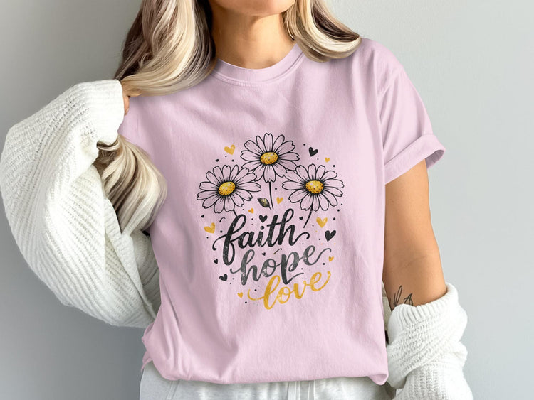 Pink t-shirt with "faith hope love" text and daisy illustrations.