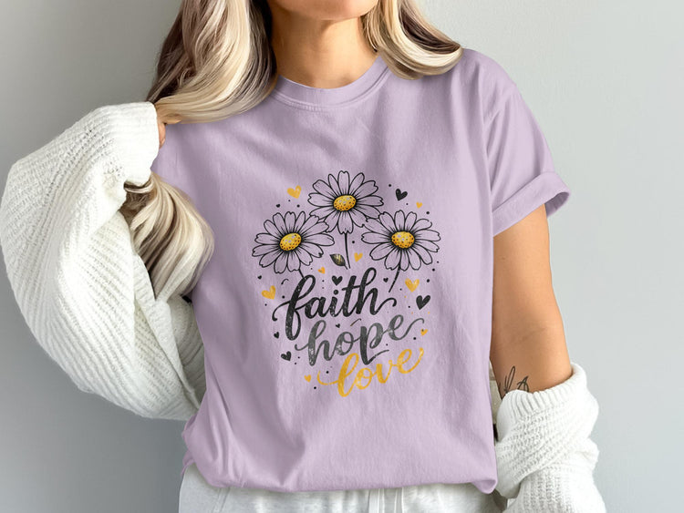 Purple t-shirt with "faith hope love" text and daisy flowers.