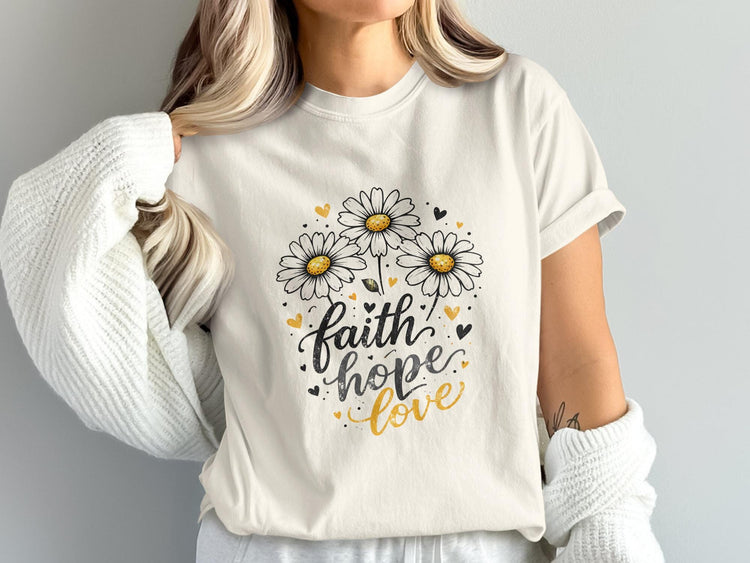 Cream t-shirt with daisies and "faith hope love" text.