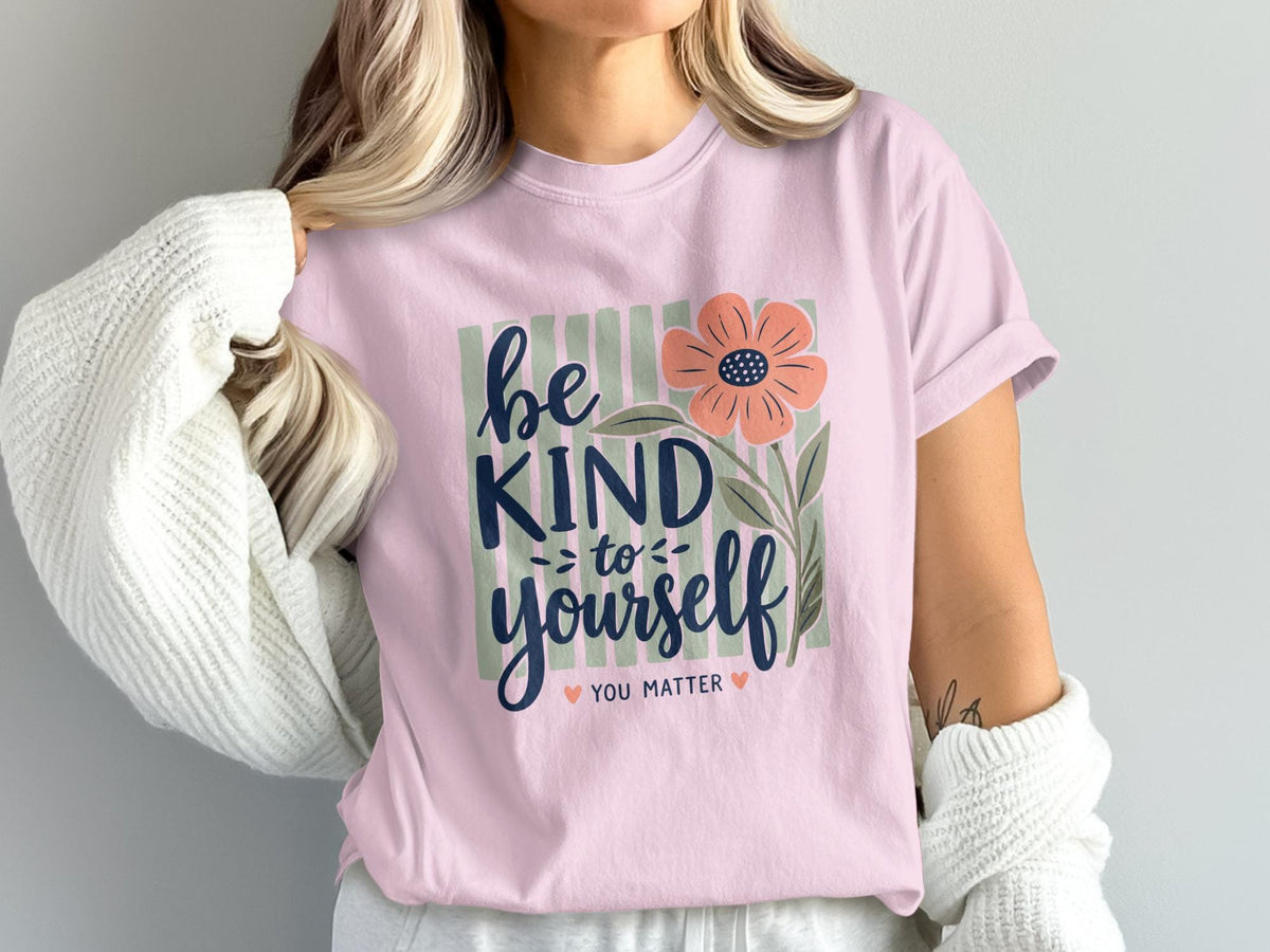 Pale pink t-shirt with "be kind to yourself you matter" and floral graphic.