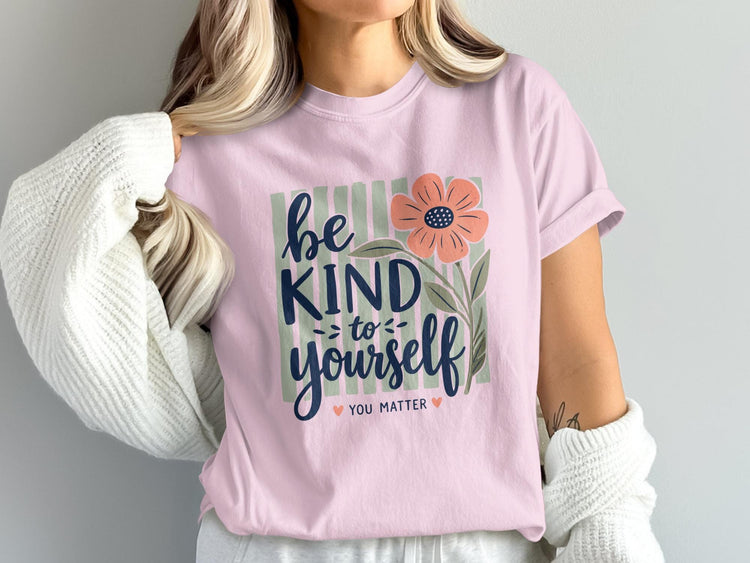 Pale pink t-shirt with "be kind to yourself you matter" and floral graphic.