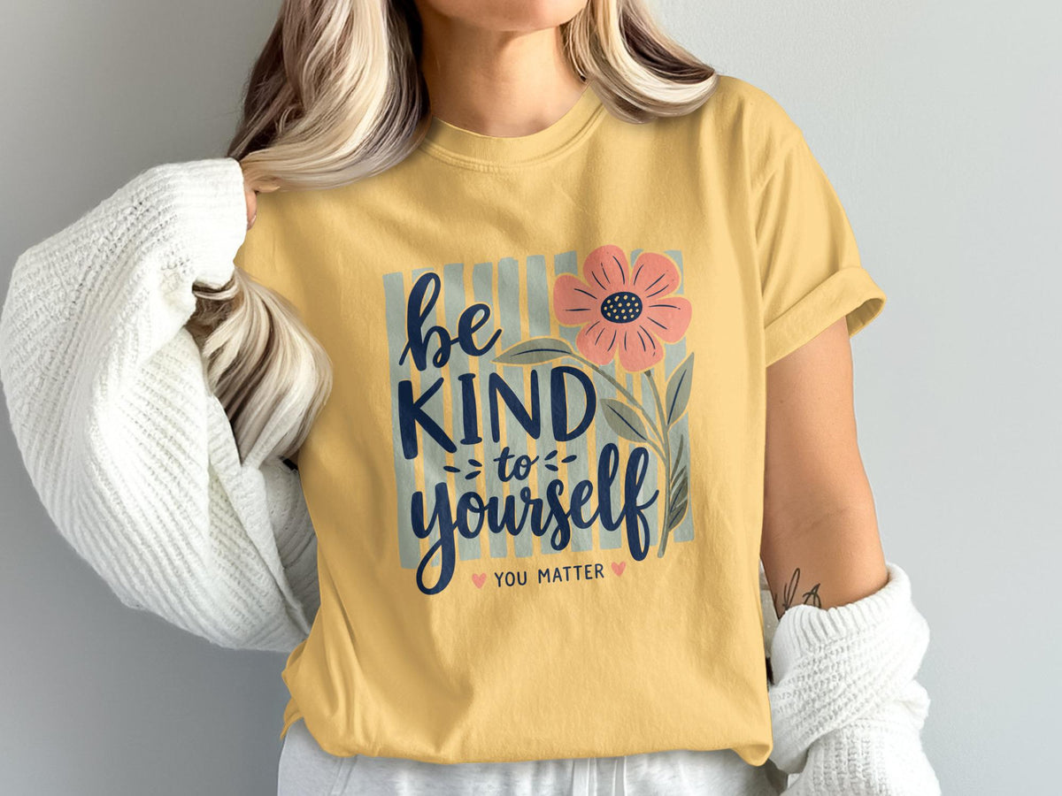 Yellow t-shirt with "be kind to yourself you matter" text and floral graphic.