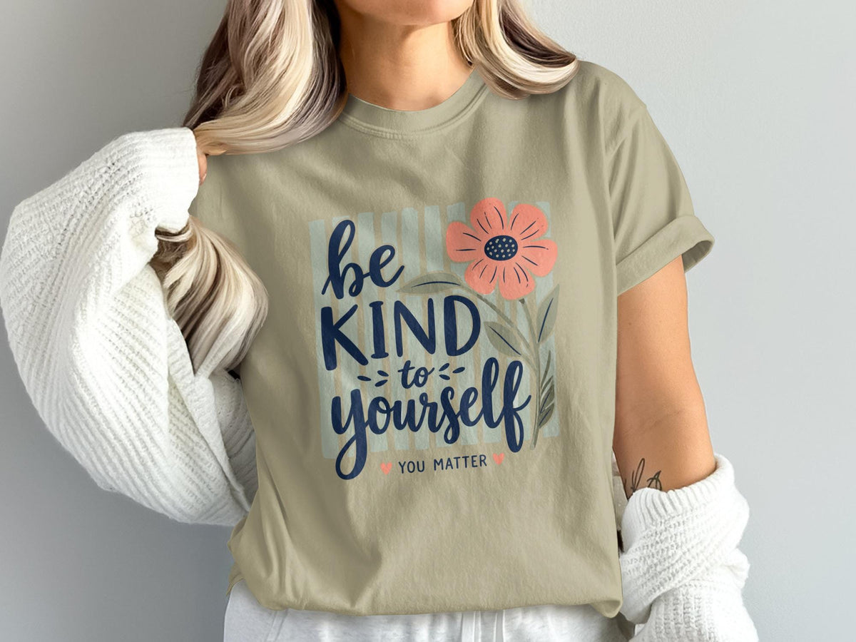 Be kind to yourself, you matter text with flower design on beige t-shirt.