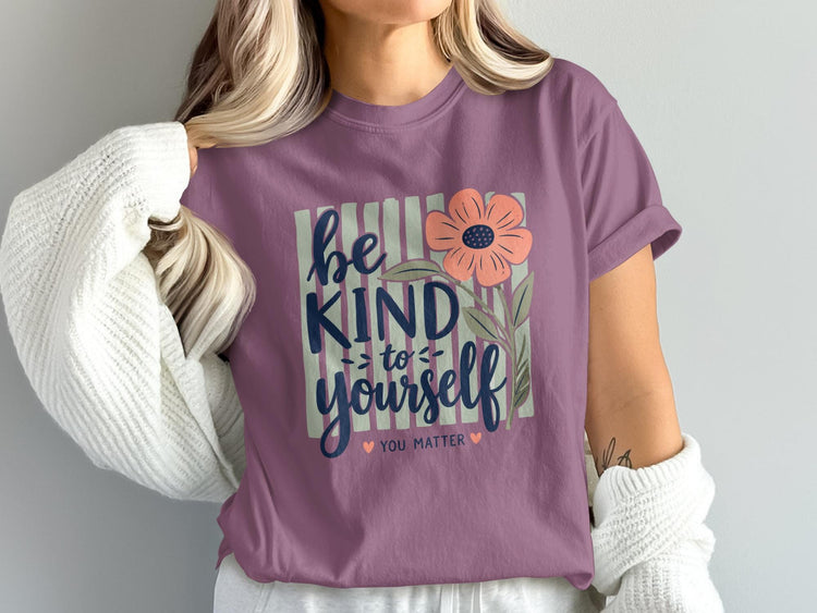 Purple t-shirt with "be kind to yourself you matter" and a floral design.