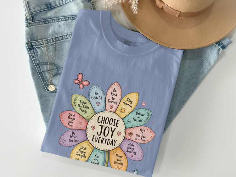Light blue t-shirt with "Choose Joy Everyday" and inspirational quotes arranged in a flower.