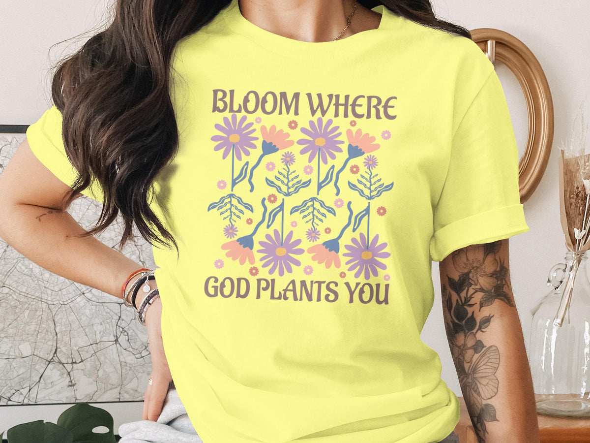 Yellow t-shirt with floral design and "Bloom Where God Plants You" text.