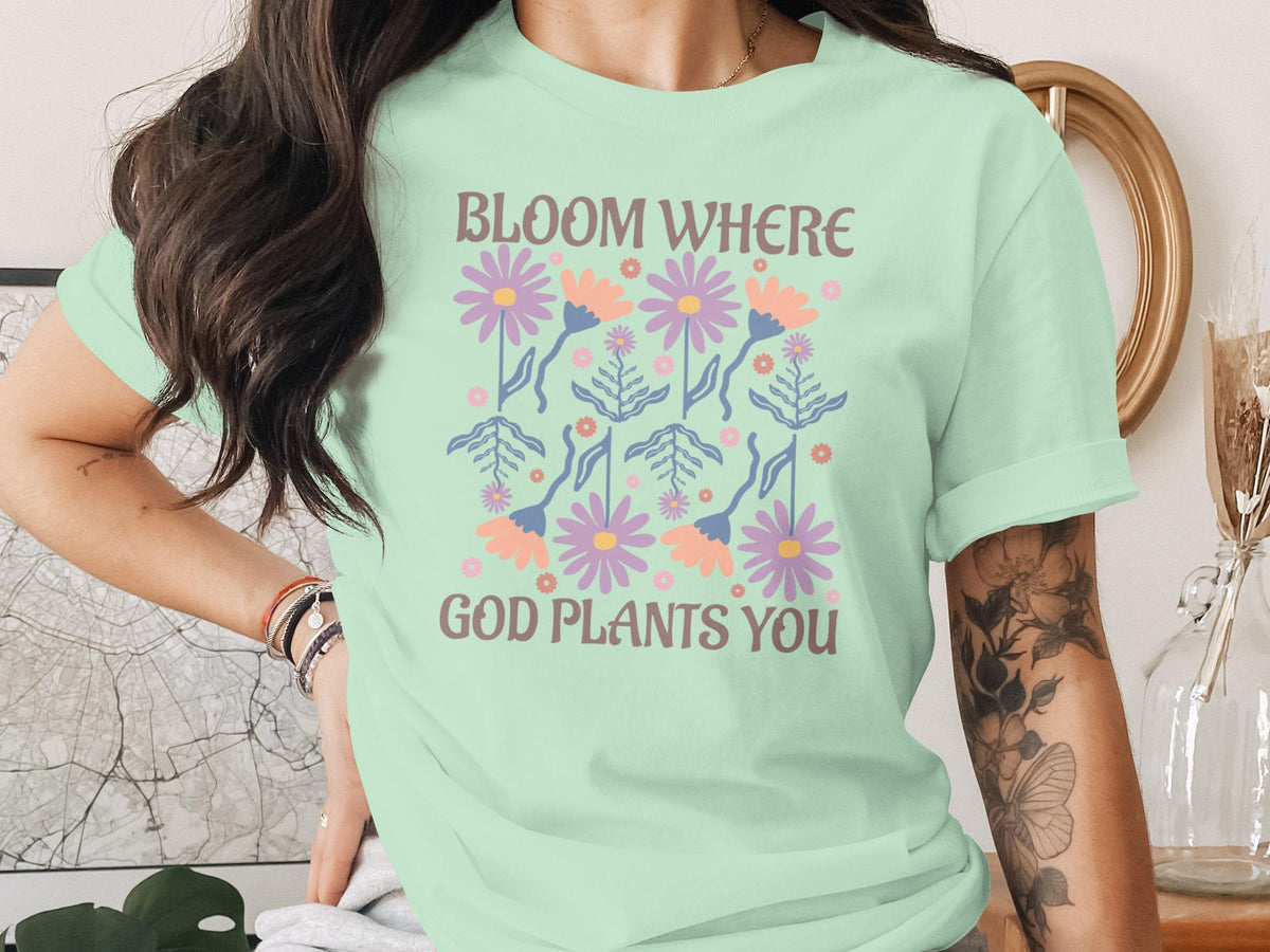 Mint t-shirt with floral design and text "Bloom Where God Plants You".