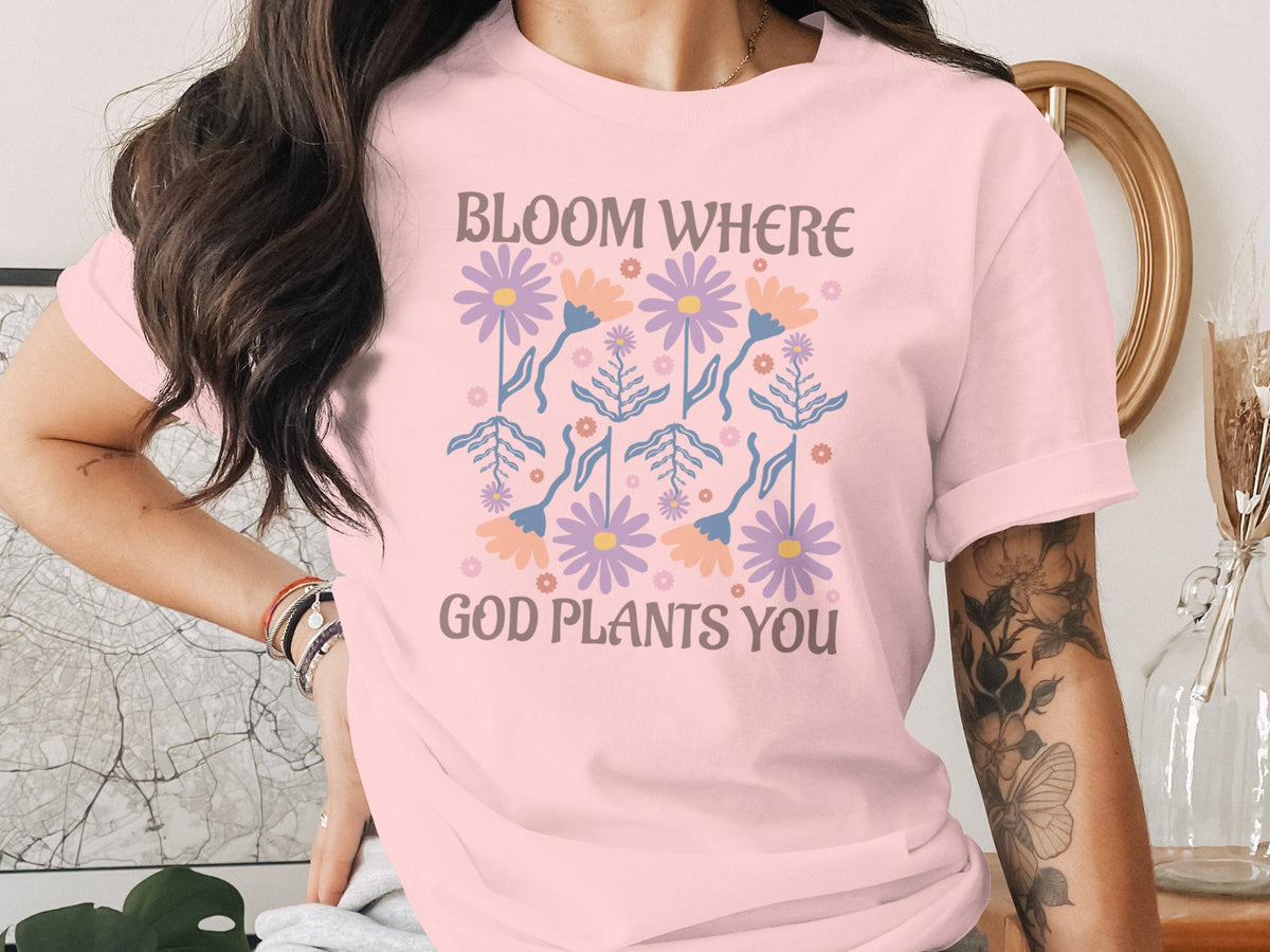 Pink t-shirt with floral graphic and text "BLOOM WHERE GOD PLANTS YOU".