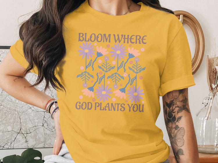 Yellow t-shirt with "Bloom Where God Plants You" and floral design.