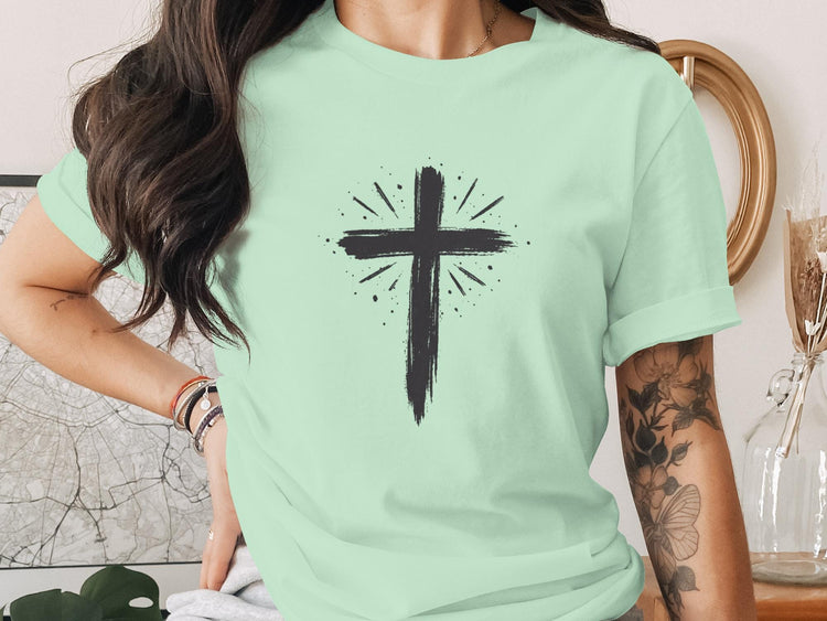 Mint green t-shirt with a black distressed cross graphic.