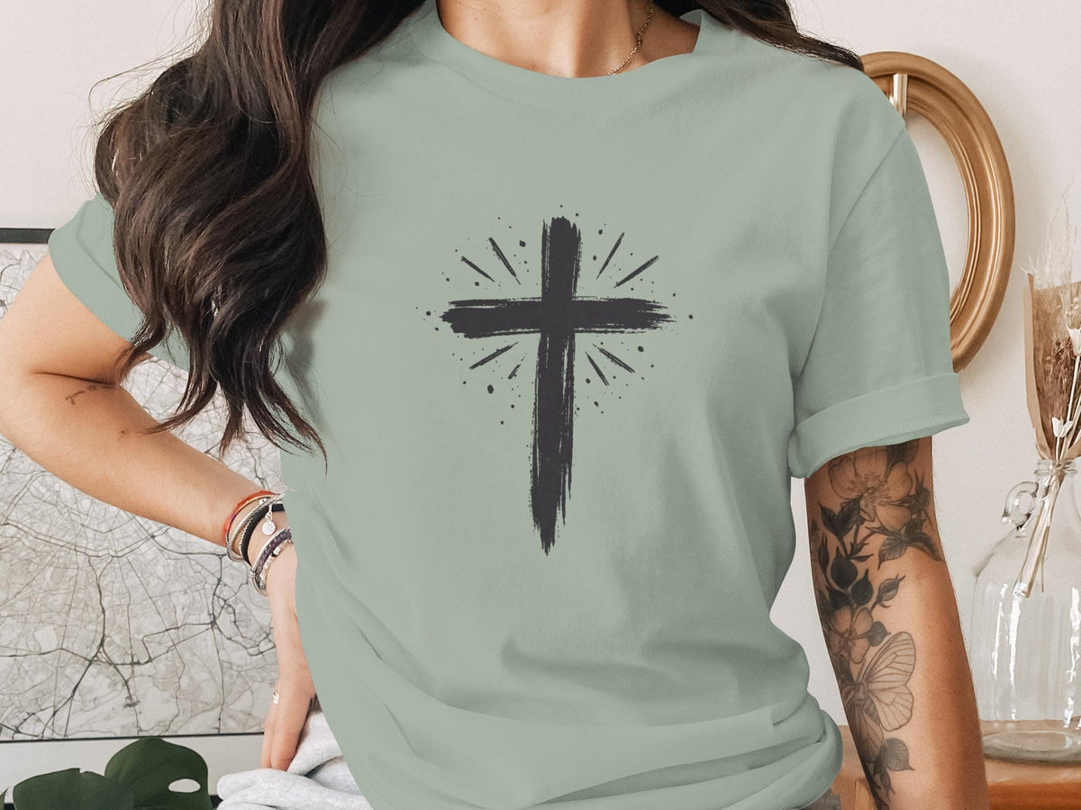T-shirt with a dark grey, distressed cross graphic and radiating lines.