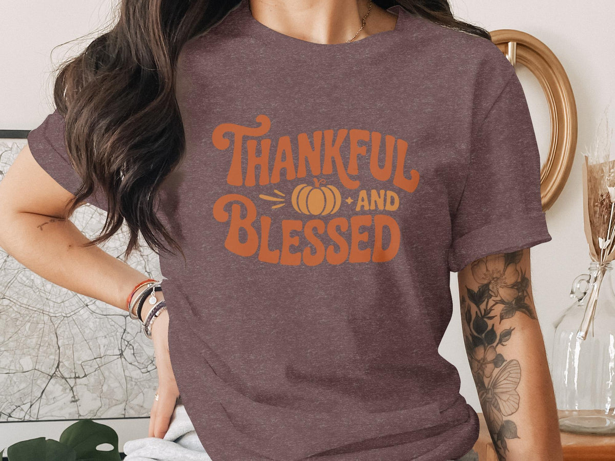 Brown t-shirt with "Thankful AND BLESSED" text and pumpkin graphic.