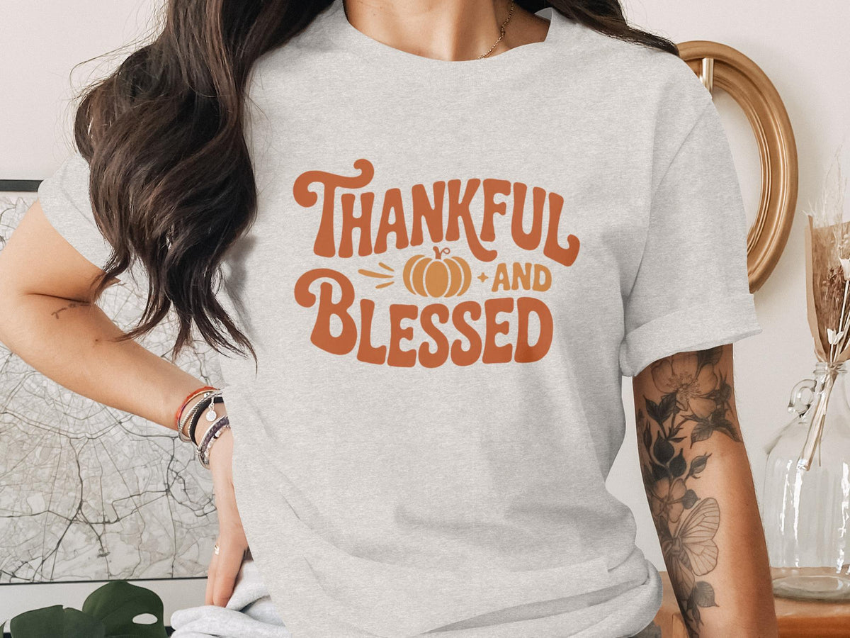 Light grey t-shirt with "Thankful AND Blessed" text and a pumpkin graphic.