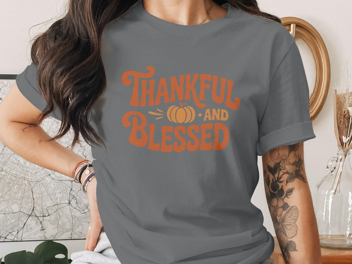 Gray t-shirt with "Thankful and Blessed" text and a small pumpkin graphic.